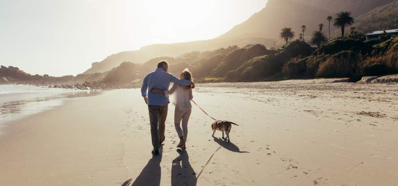 retired couple on the beach