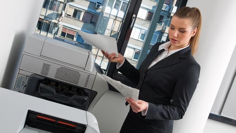 woman deciding on wether to choose renting or buying a photocopier