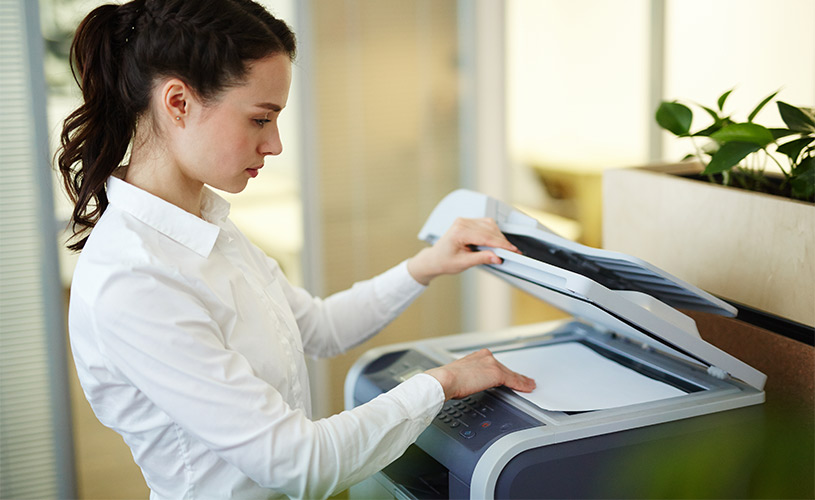 woman using a photocopier rental
