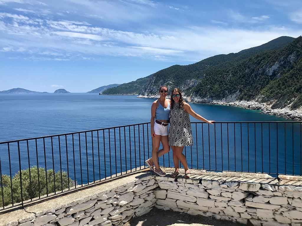 Two women in Greece at ocean lookout