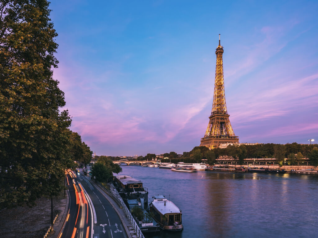 Woman in swimsuit on a swing in tropical location.