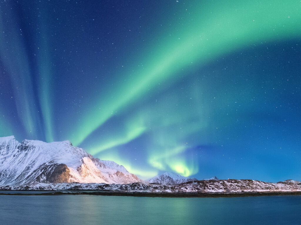 Woman in swimsuit on a swing in tropical location.