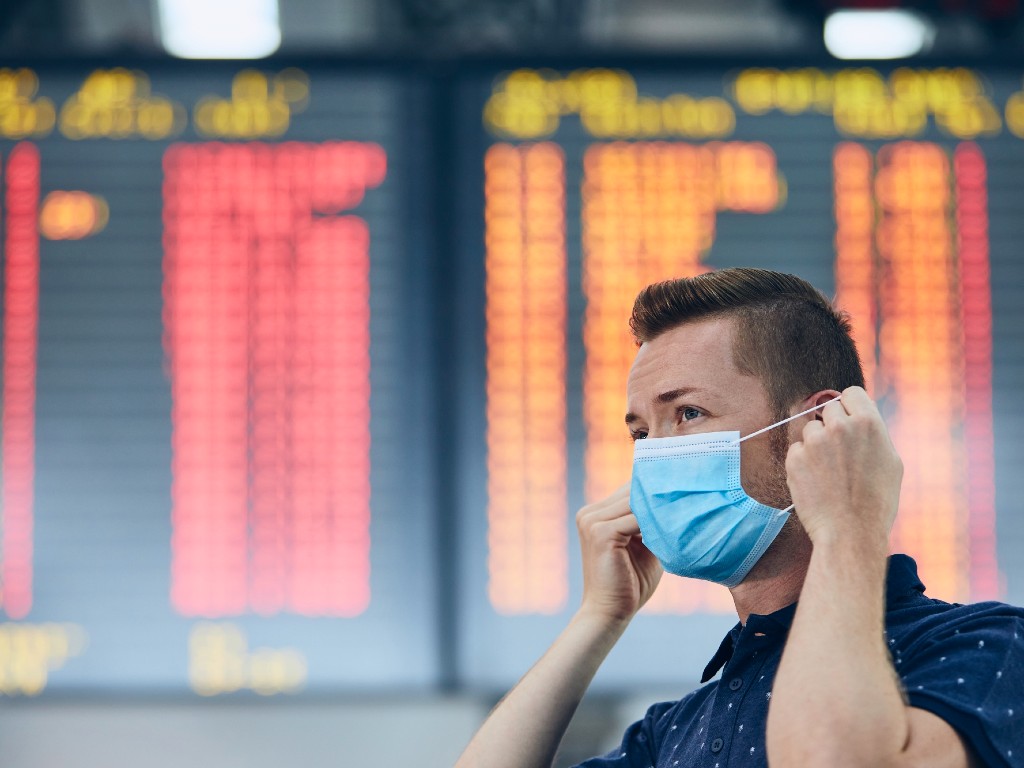 traveler in mask at the airport