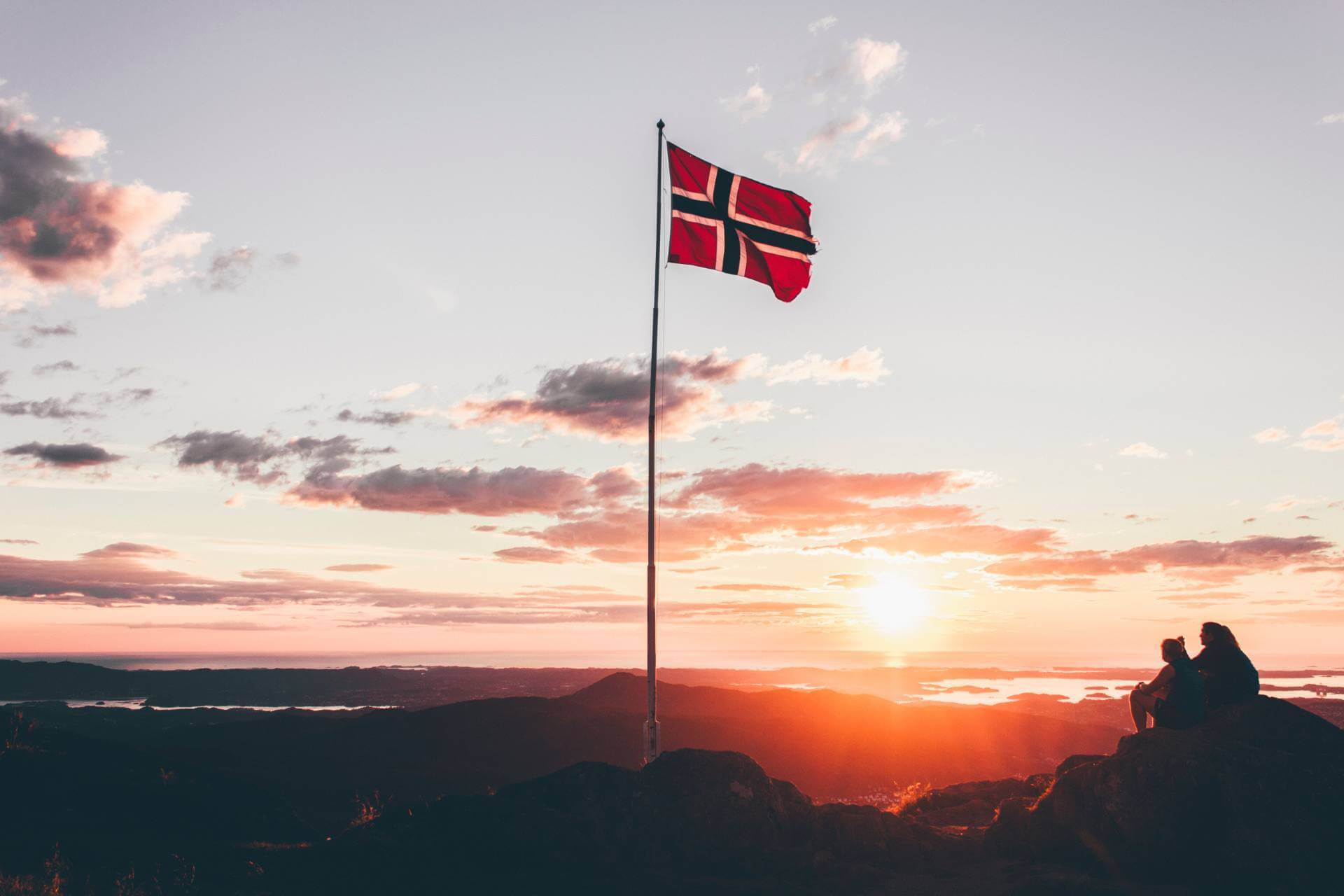 Norwegian flag on a mountain.