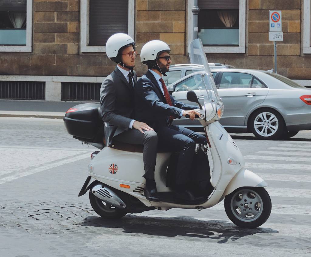 two people on a Vespa in Rome.