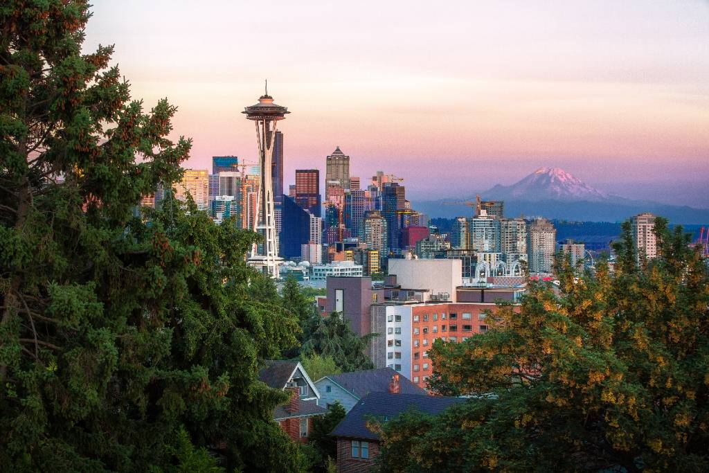 view of Seattle with Space Needle and mountain.
