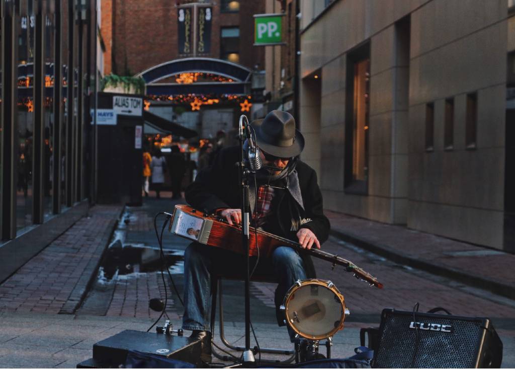 busker playing music on street in Dublin.
