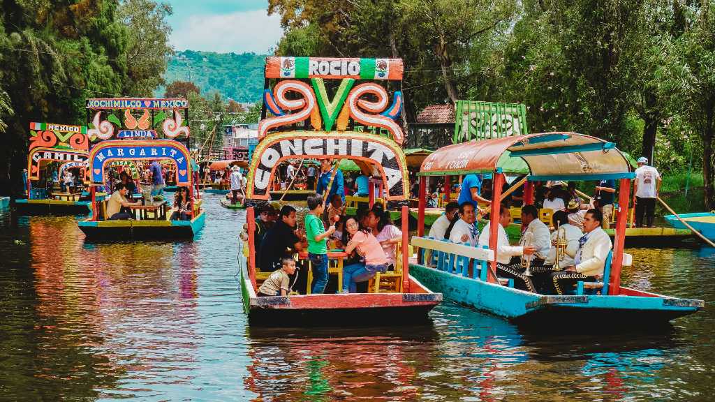 colorful boats on the Xochimilco canals in Mexico City.