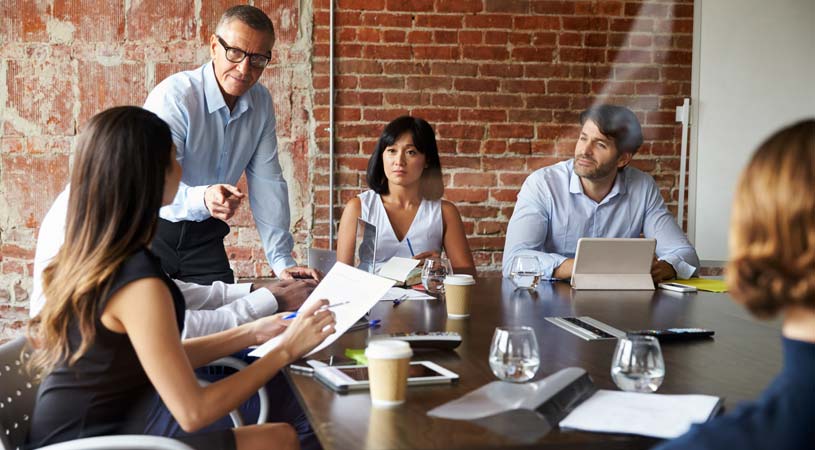 manager talking to his team in a meeting