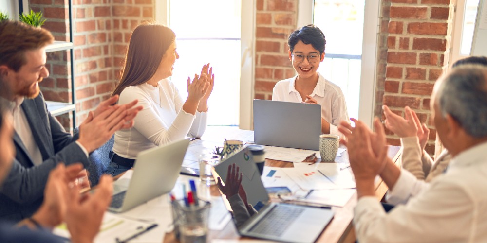 employees applauding success