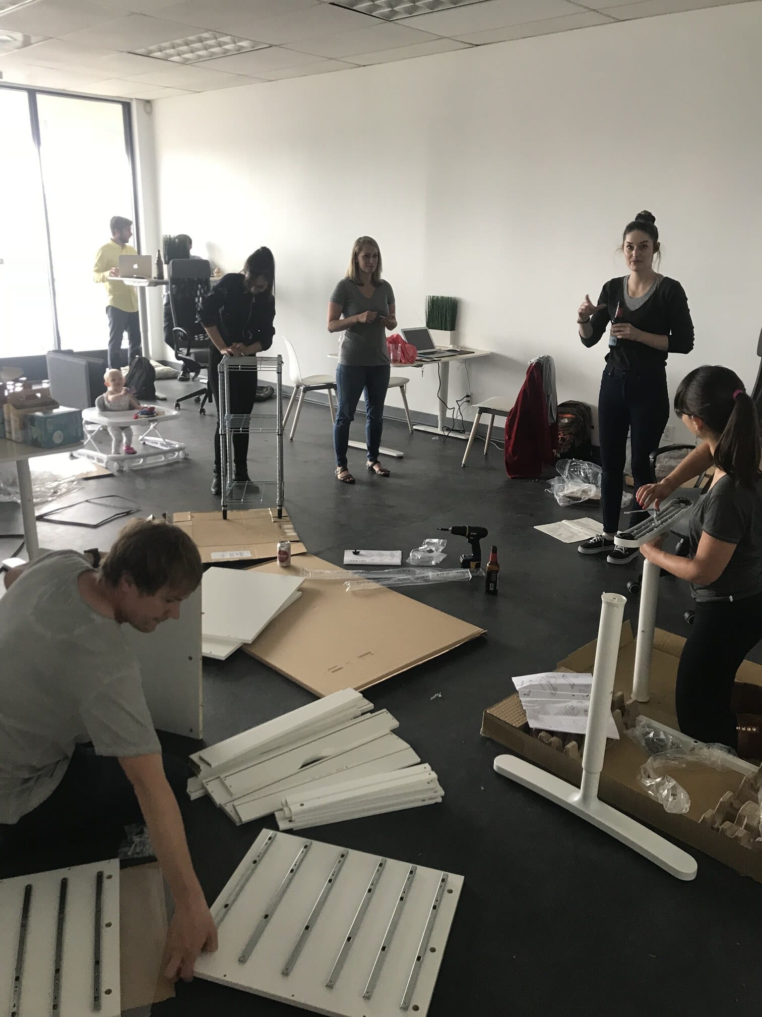 CareRev team members assembling office furniture