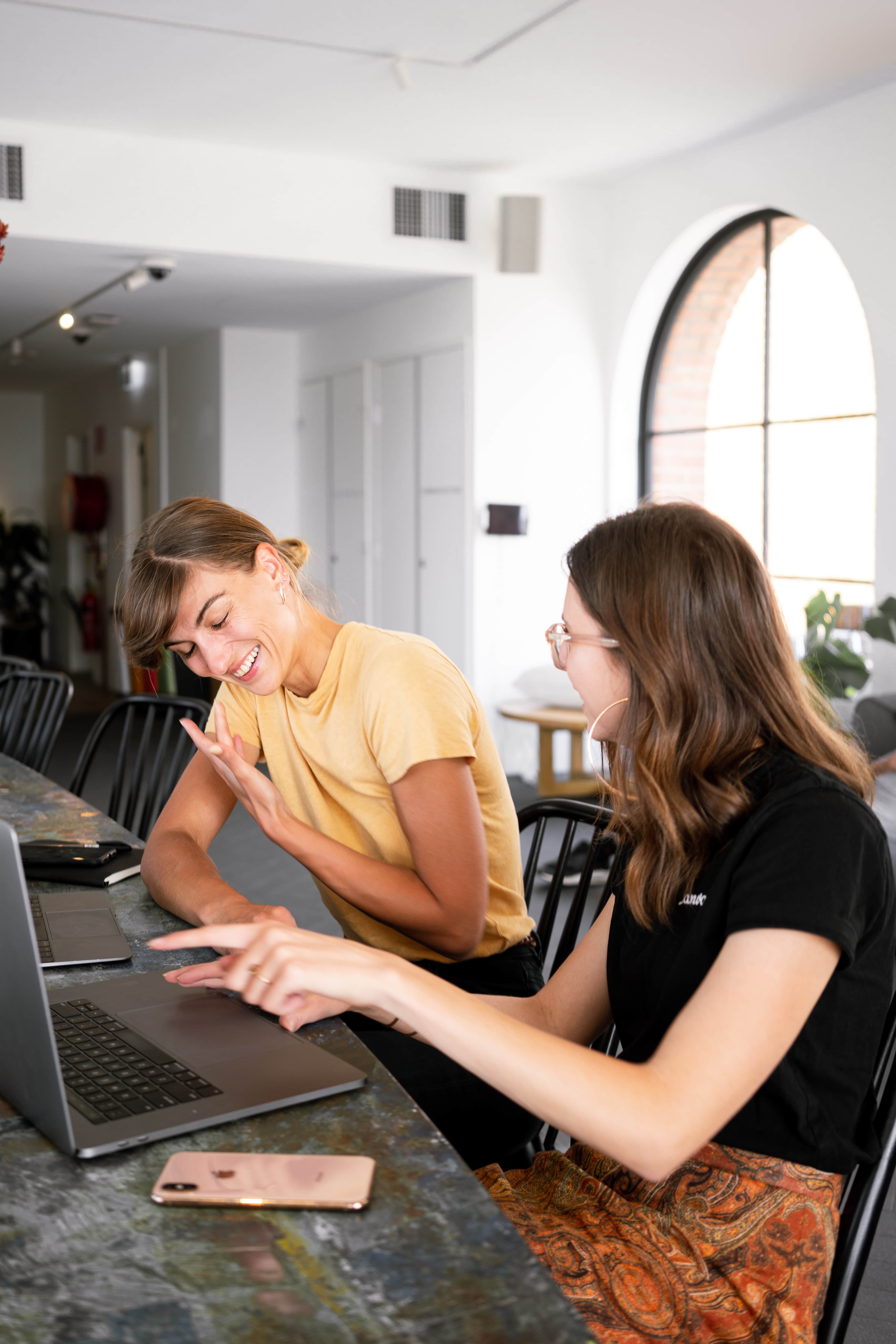 two women working on a computer