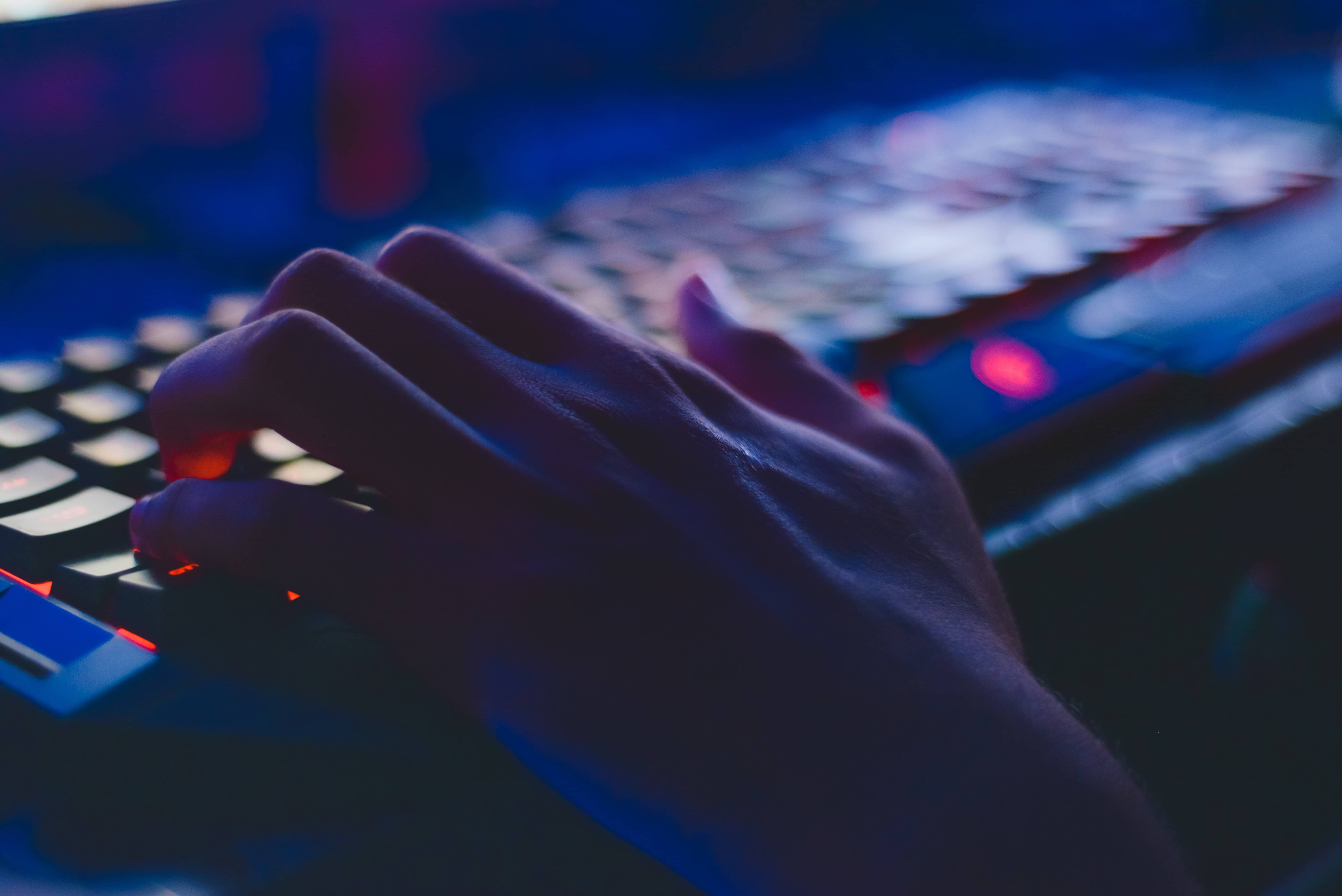 hacker typing on computer keyboard