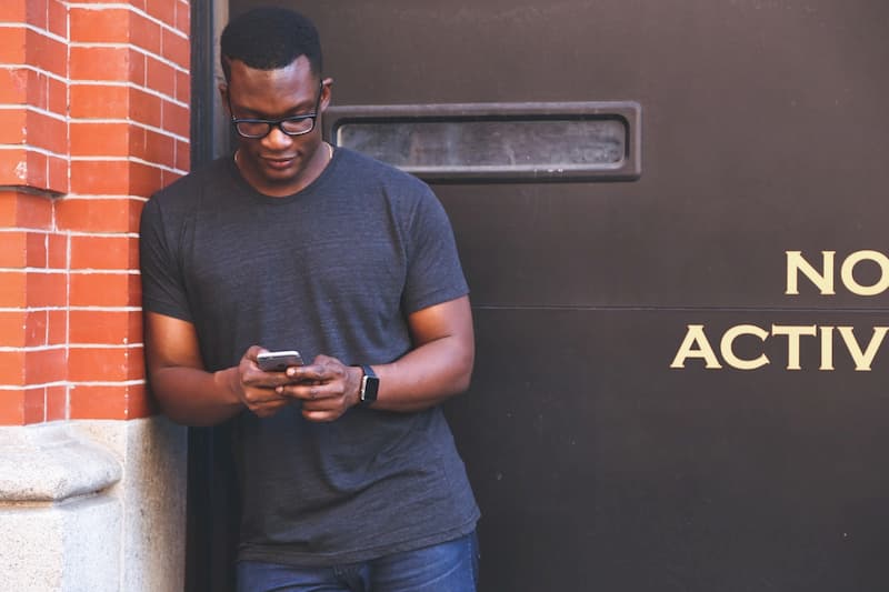 man texting on cell phone
