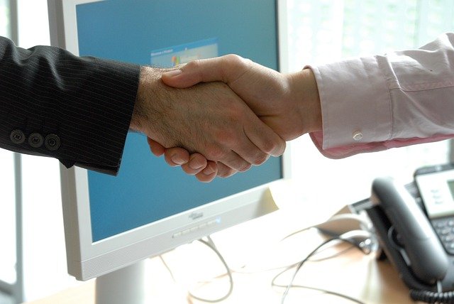two people shaking hands