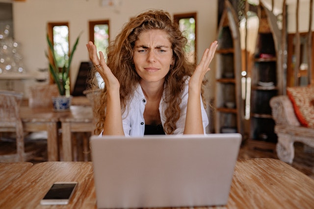 woman sitting at computer frustrated by marketing myths