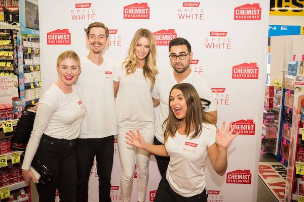 people posing in photo booth at event activation