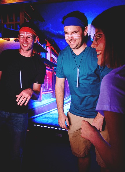 people using a photo booth at a social playground event