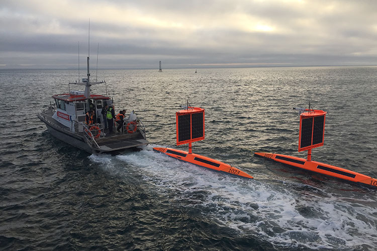 Saildrones towed out for deployment