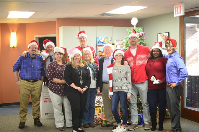 CS3 Technology Staff standing together in front of their Toys for Tots Donation