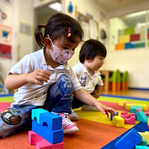 Friends playing with blocks.