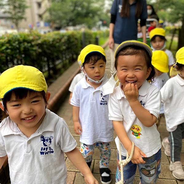 Friends laughing at park.