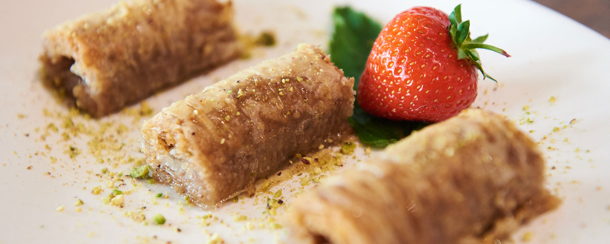 Liman restaurant image of Mediterranean food on plate with strawberry