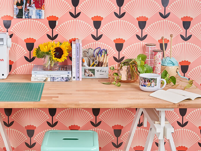 Wallpapered office with personalized desk supplies
