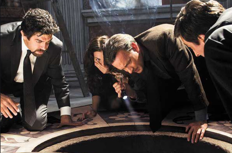 Tom Hanks (center) reprises his role as Robert Langdon in Angels & Demons