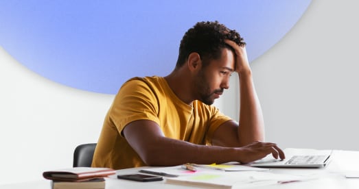 Person working with hand on forehead
