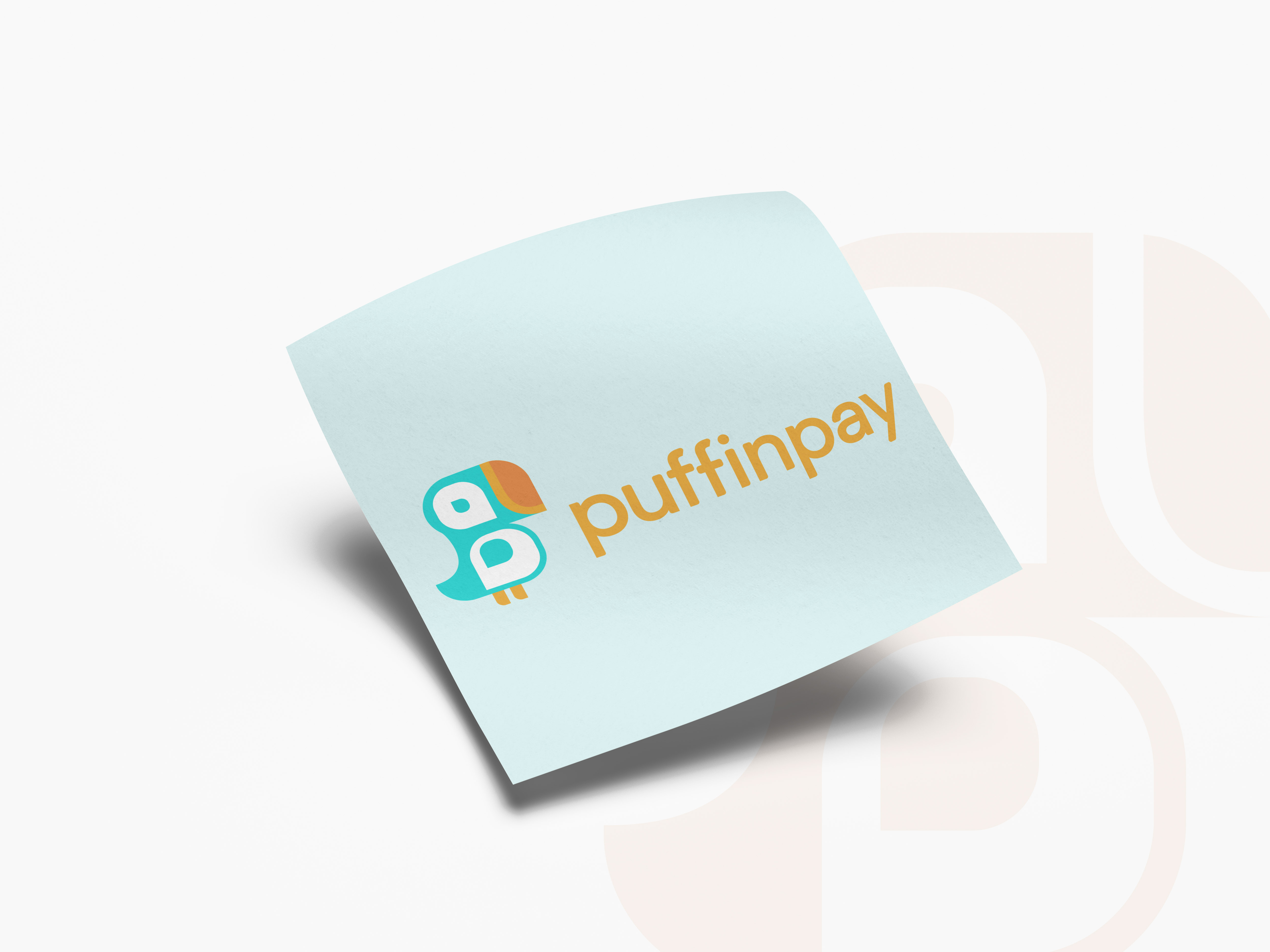 puffinpay logo mocked up on a piece of paper highlighting the vibrant color pallet with a toucan icon