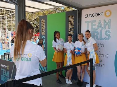 girls having photo taken at green screen event