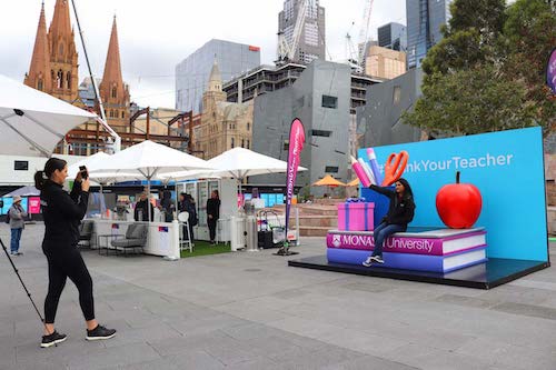 event staff taking photo of custom activation event