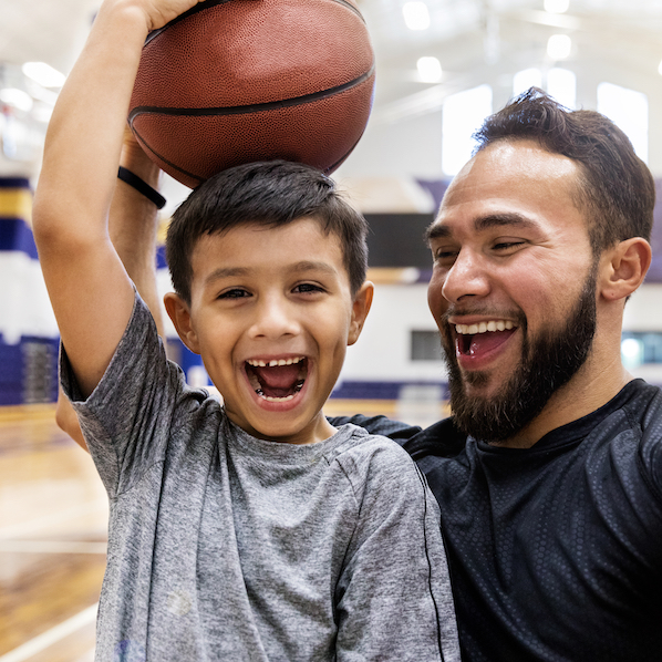 image of smiling kid and basketball