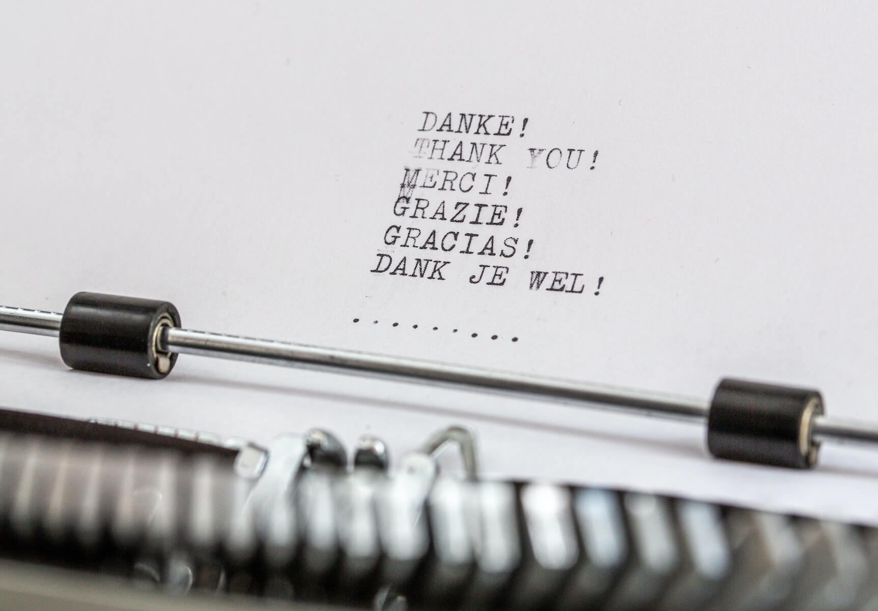 typewriter page with thank you in different language covid19 how to help