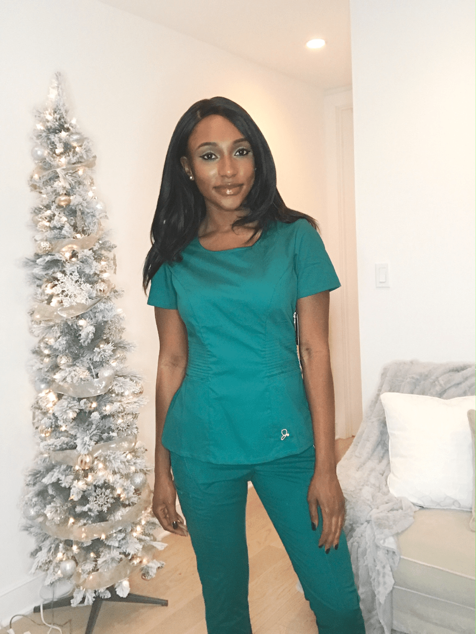 female nurse posing in scrubs side view jaanuu scrubs review