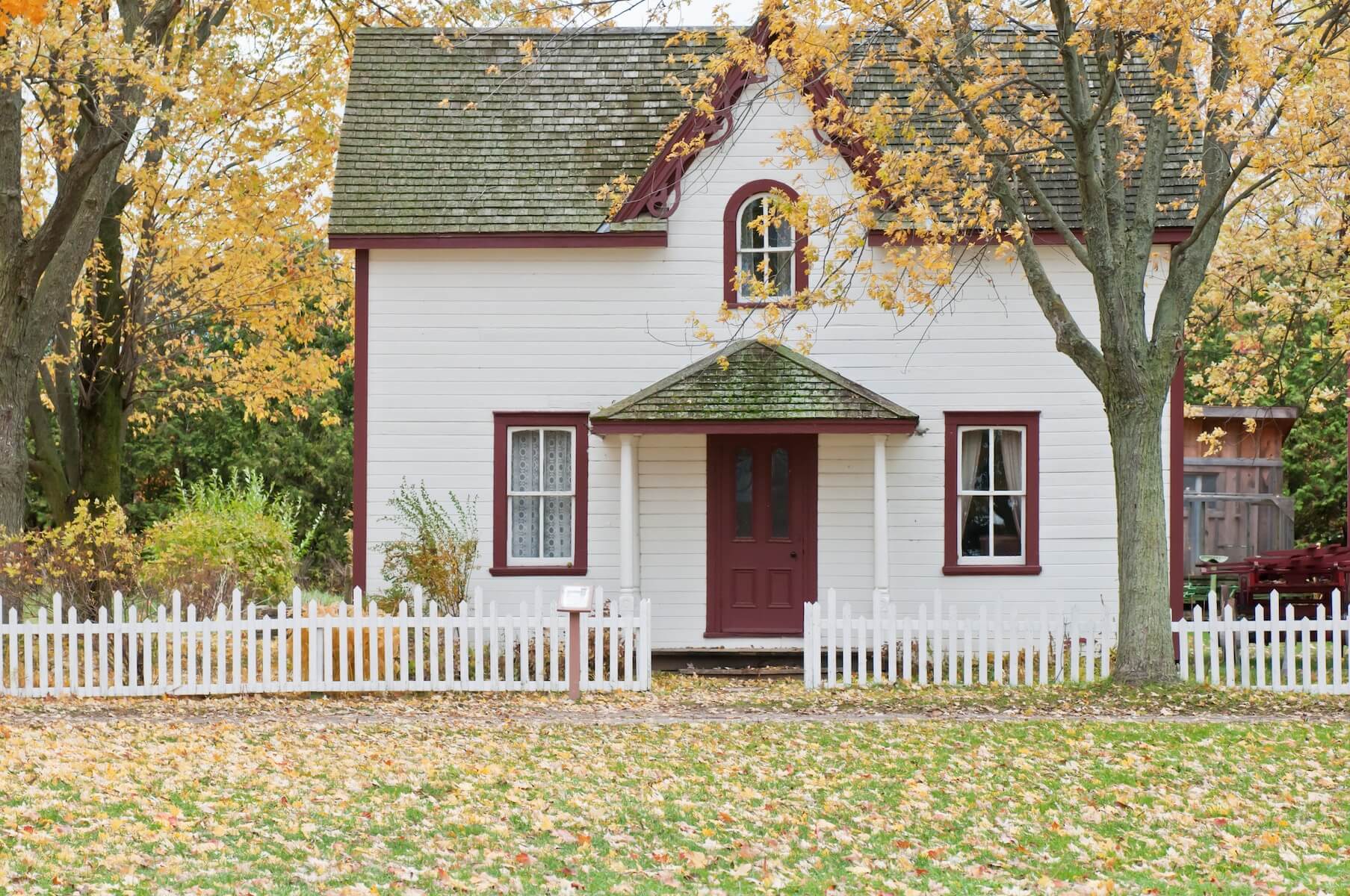 quant country house with small, autumnal front yard travel nurse taxes tax homes