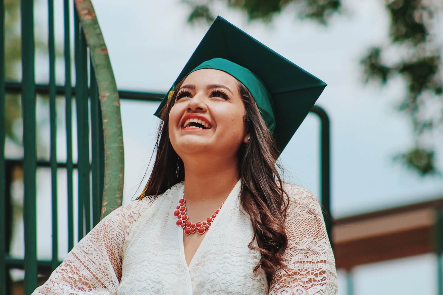 woman in dress with graduation cap on nursing education continued education