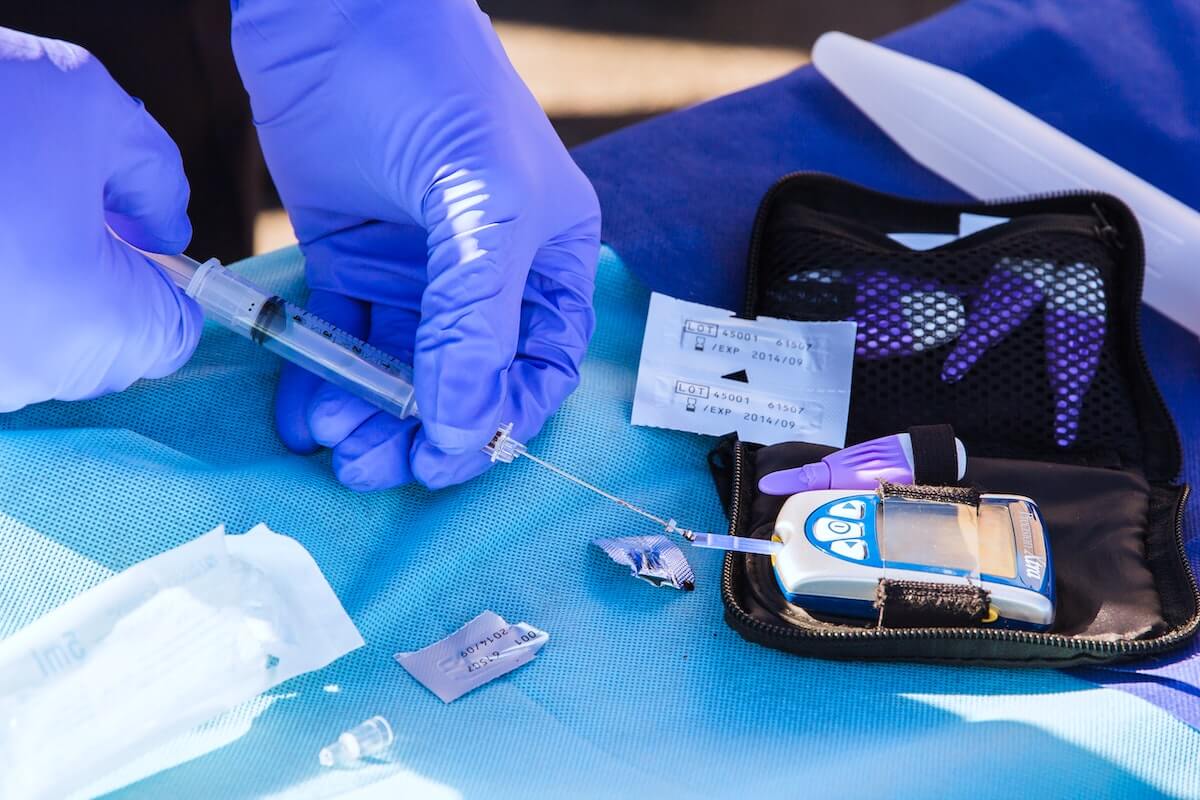 diabetes blood sugar testing kit nurse testing blood sugar