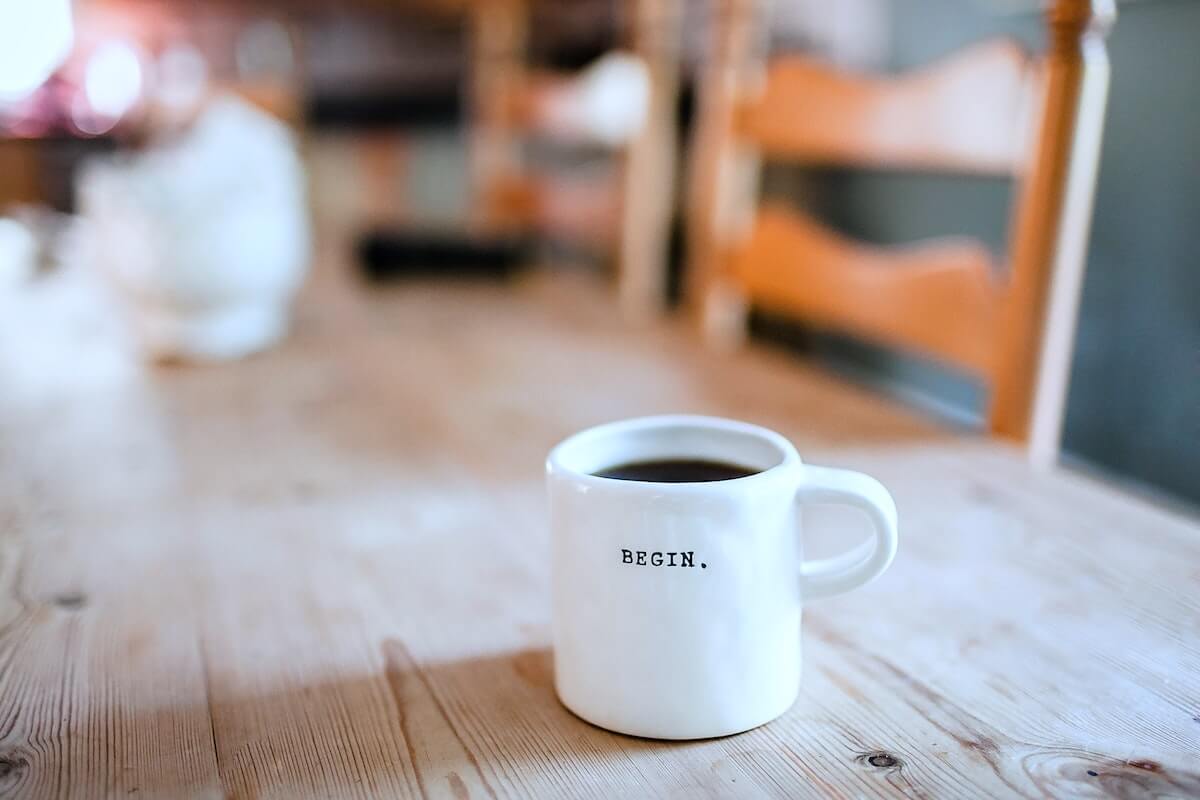 coffee mug with begin written on it sitting on dining room table begin investing for nurses