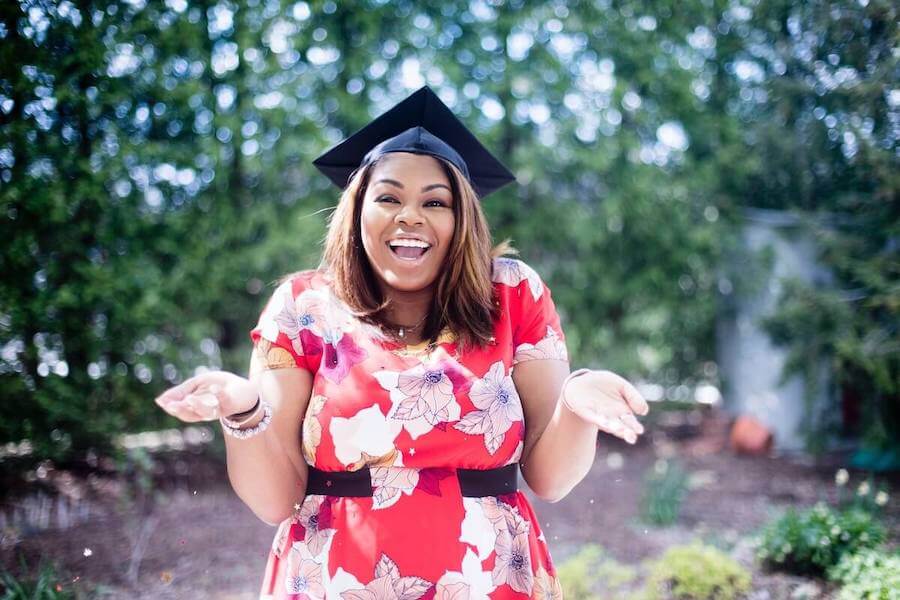 new grad nurse interview questions first job female nurse smiling