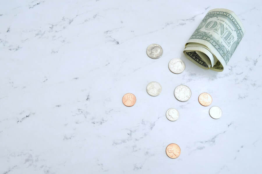 american money on marble table nursing finances