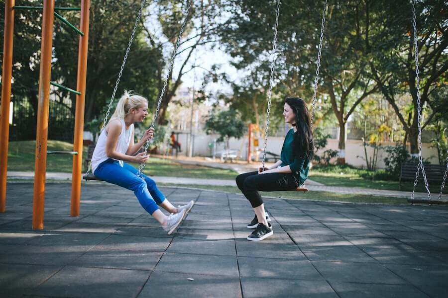 two women on swings facing each other talking things nurses should know
