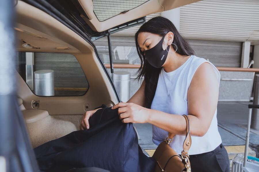 woman packing her car travel nursing what to pack on your first assignment