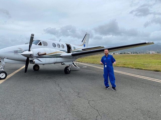 plane on runway with man justin bartlett RN flight nursing