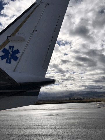 tail of plane on runway flight nursing