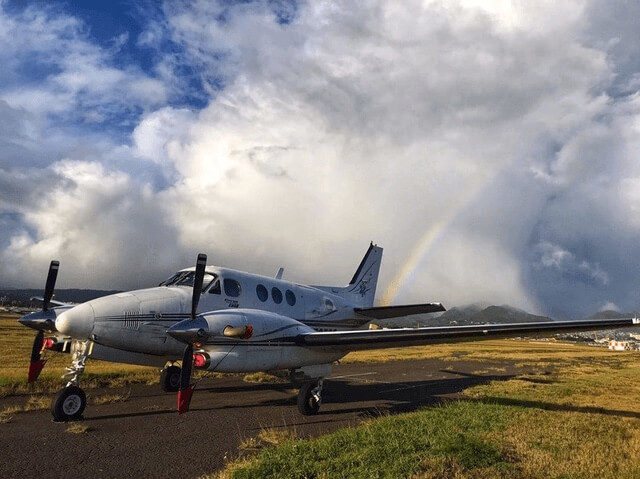 plane on runway in front of rainbow flight nursing