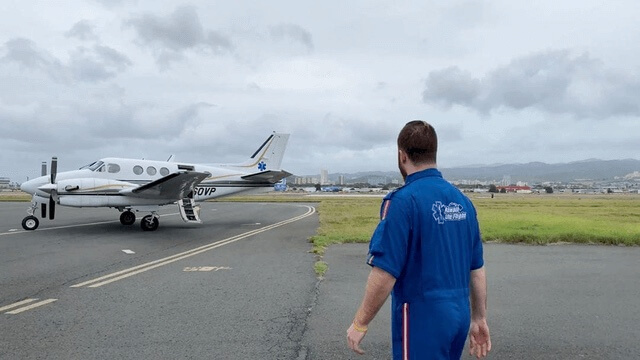 plane on runway man in front justin bartlett RN flight nursing