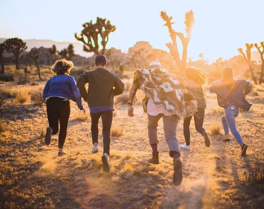 five people running in desert travel nurses exploring after work staff nurse to travel nurse