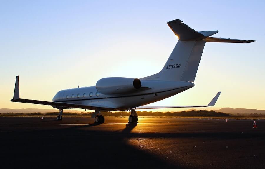 plane on runway at sunset travel nursing flight staff nurse to travel nurse